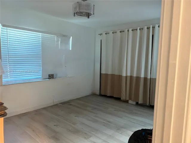 a bathroom with a sink and a shower curtain