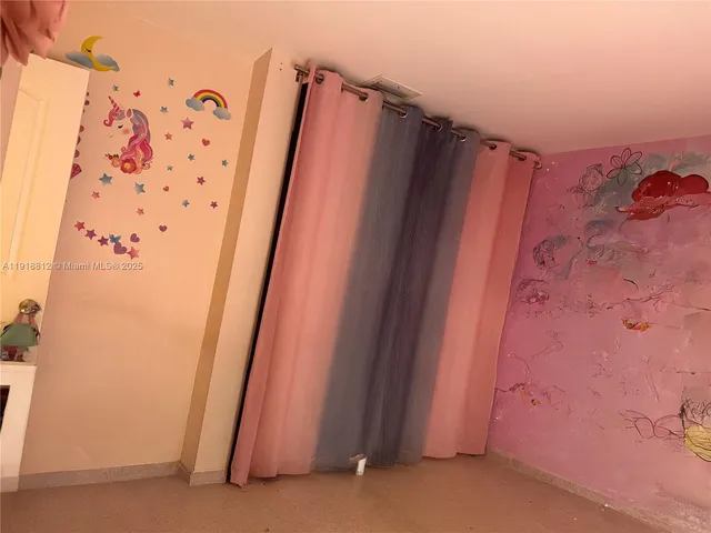 a workspace with furniture and a flat screen tv