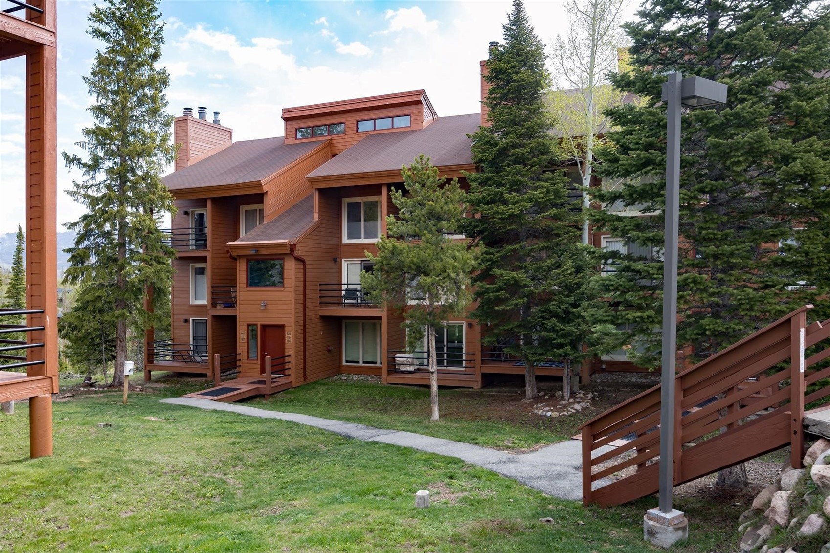 91100 Ryan Gulch Road, Unit 91105 Silverthorne, CO 80498 - Photo 3 of 49 a view of a house with a yard