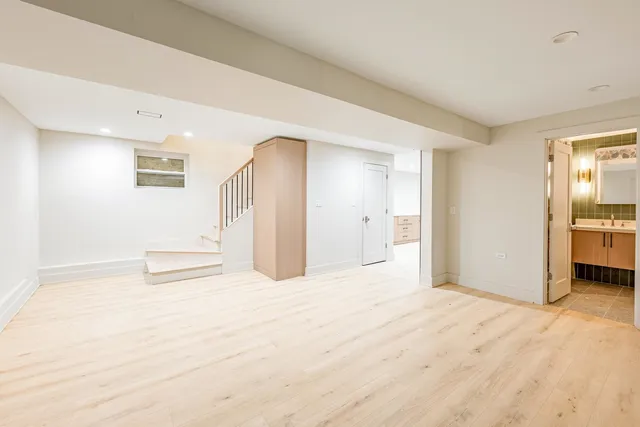 a view of a hallway with stairs