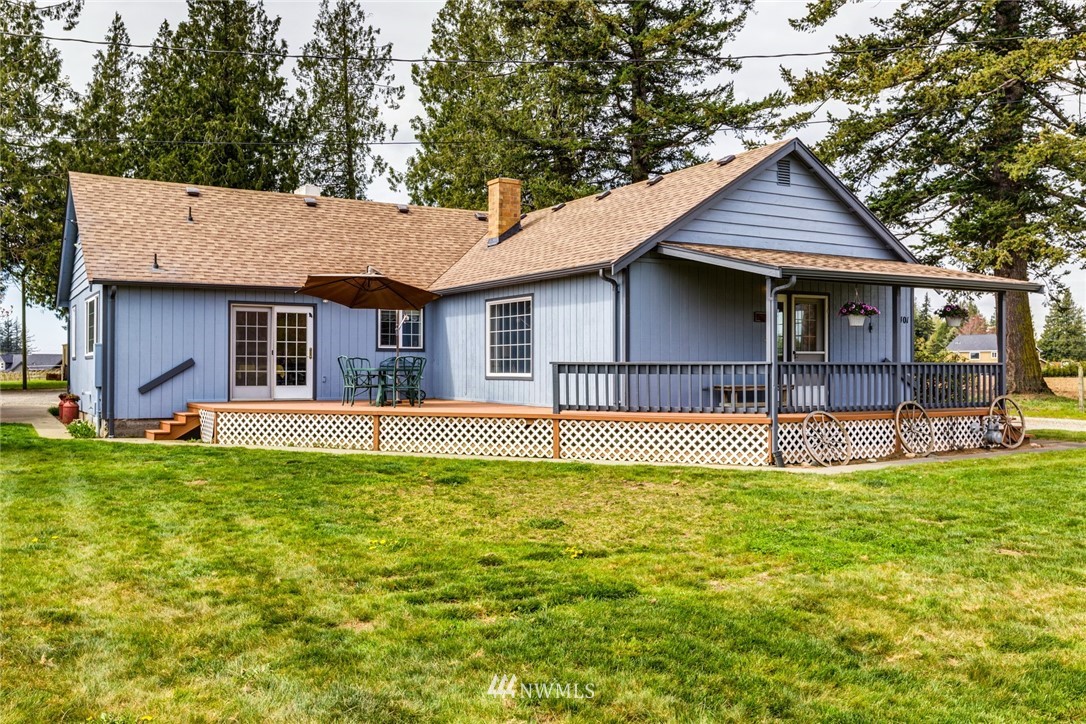 401 West Pole Road Lynden, WA 98264 - Photo 1 of 40 a house that has a large pool in front of it