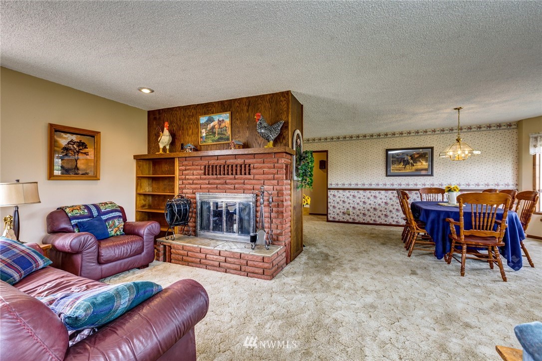 401 West Pole Road Lynden, WA 98264 - Photo 15 of 40 a living room with furniture and a fireplace