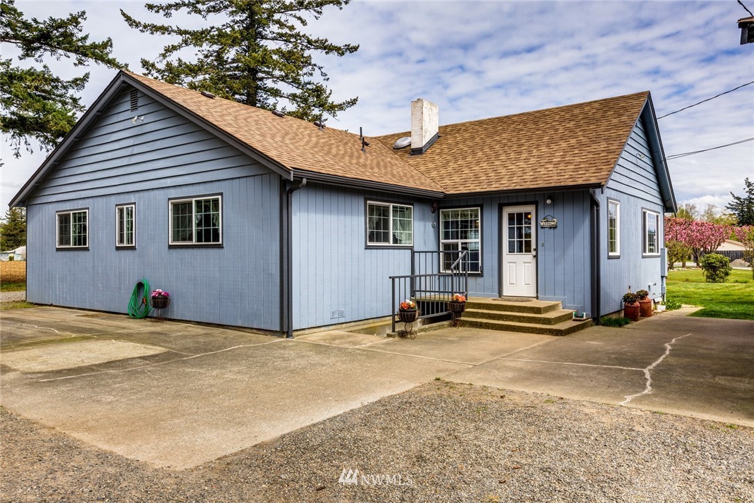 401 West Pole Road Lynden, WA 98264 - Photo 4 of 40 a view of the house with backyard and sitting area