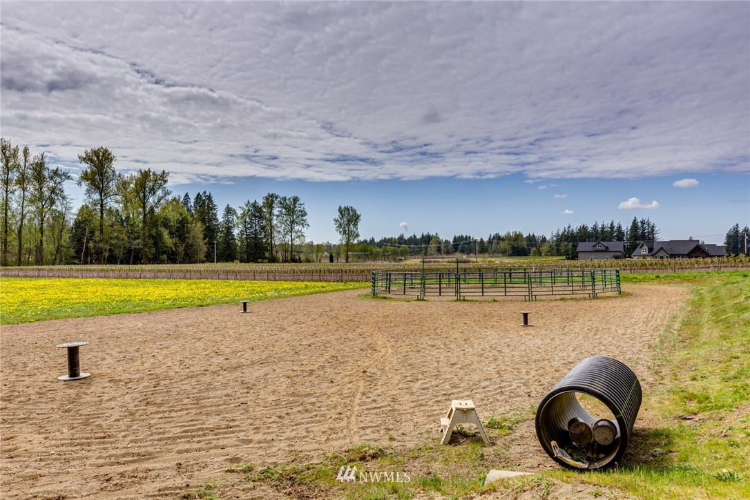 401 West Pole Road Lynden, WA 98264 - Photo 32 of 40 a view of a swimming pool and lake in back