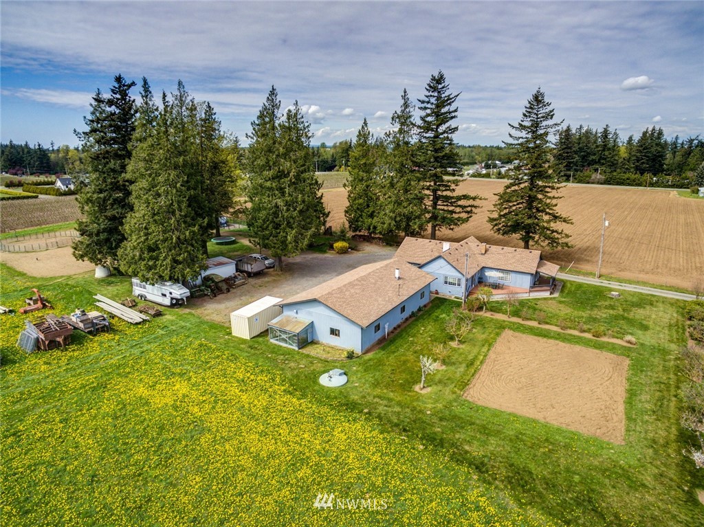 401 West Pole Road Lynden, WA 98264 - Photo 35 of 40 an aerial view of a house with swimming pool and big yard