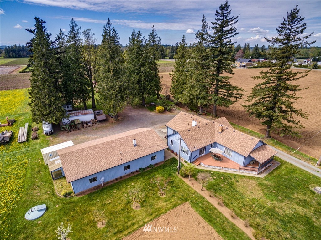401 West Pole Road Lynden, WA 98264 - Photo 40 of 40 an aerial view of a house with a garden and lake view