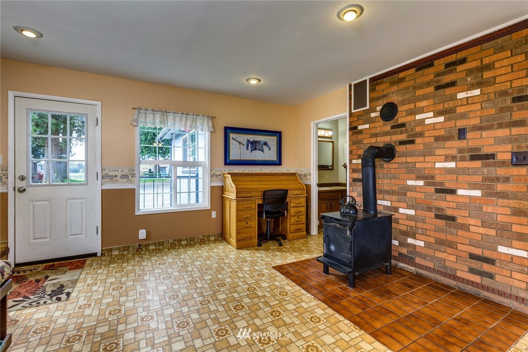 401 West Pole Road Lynden, WA 98264 - Photo 8 of 40 a living room with fireplace furniture and a window
