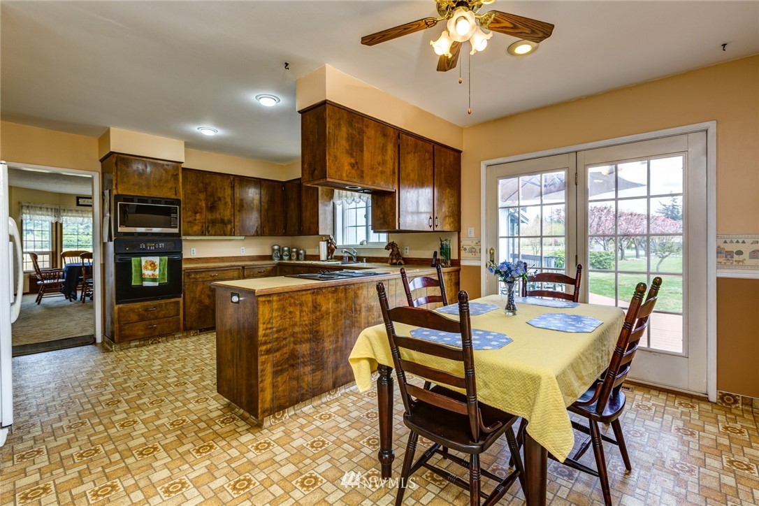 401 West Pole Road Lynden, WA 98264 - Photo 9 of 40 a view of a dining room with furniture window and outside view