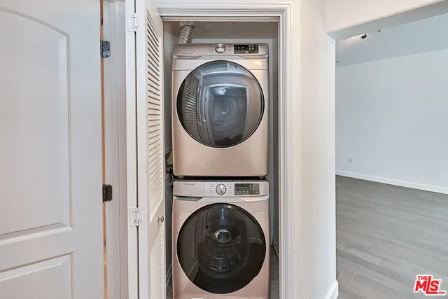 a view of a hallway with washer and dryer