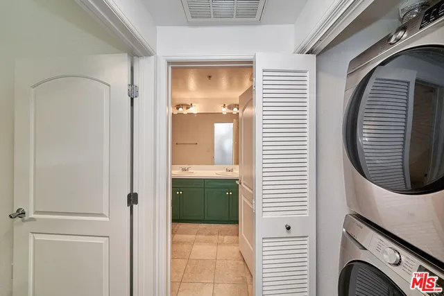 a bathroom with a sink a mirror and a shower