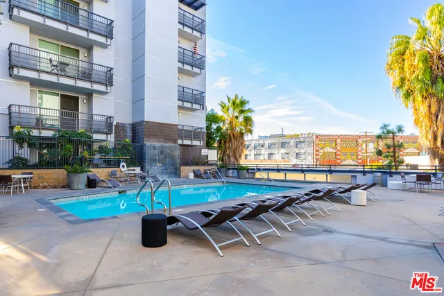 a view of a swimming pool with a lounge chairs