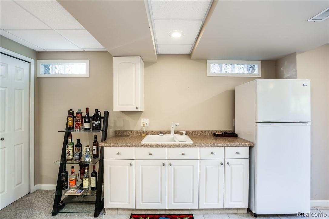 403 Whitney Drive Rochester, MI 48307 - Photo 21 of 25 Kitchenette in finished basement. All appliances stay!