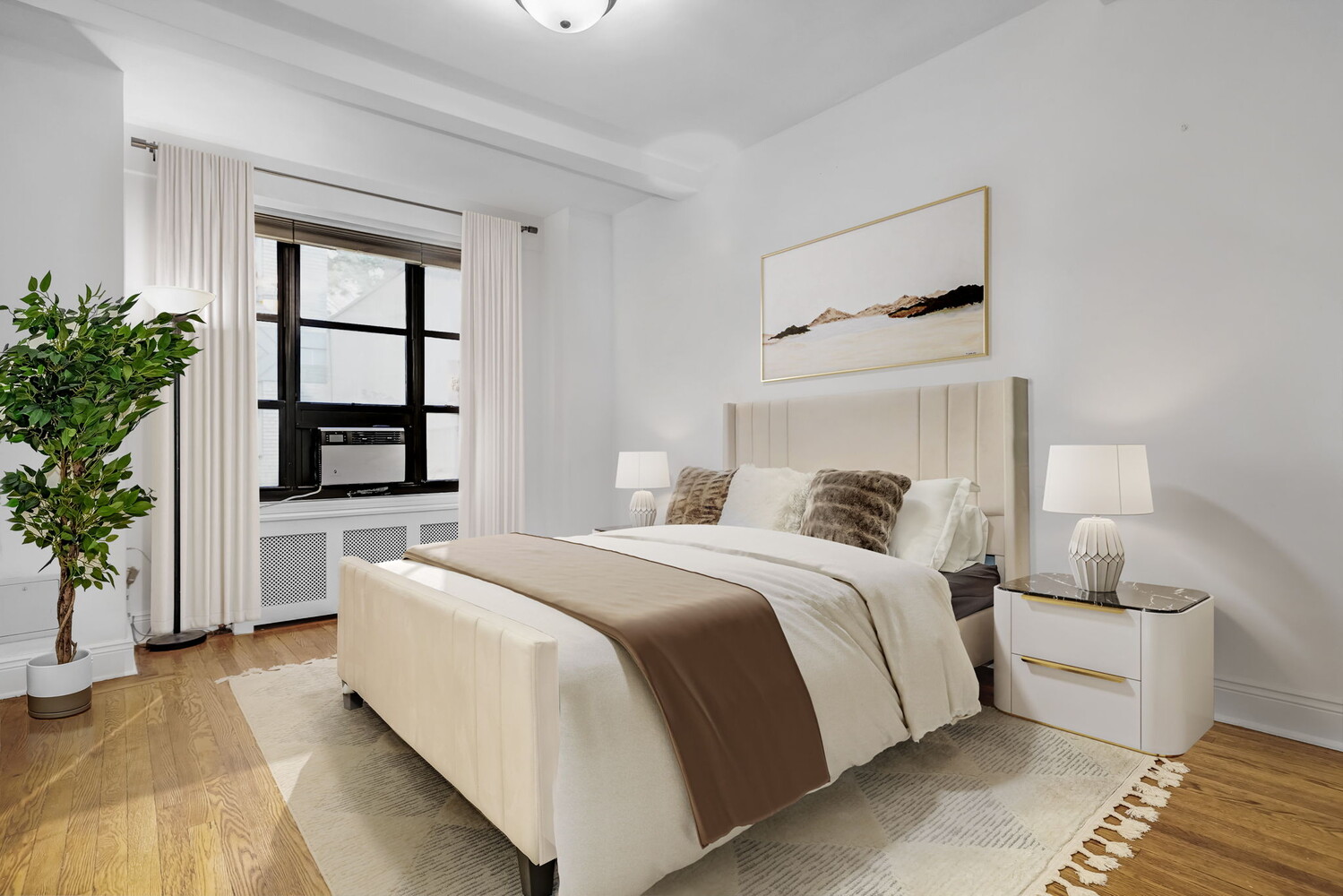 235 East 22nd Street, Unit 2T Manhattan, NY 10010 - Photo 3 of 12 a bedroom with a large bed and a window