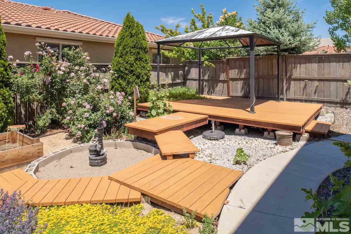 475 Silver Bridle Court Reno, NV 89521 - Photo 24 of 35 a view of a patio with chairs and potted plants