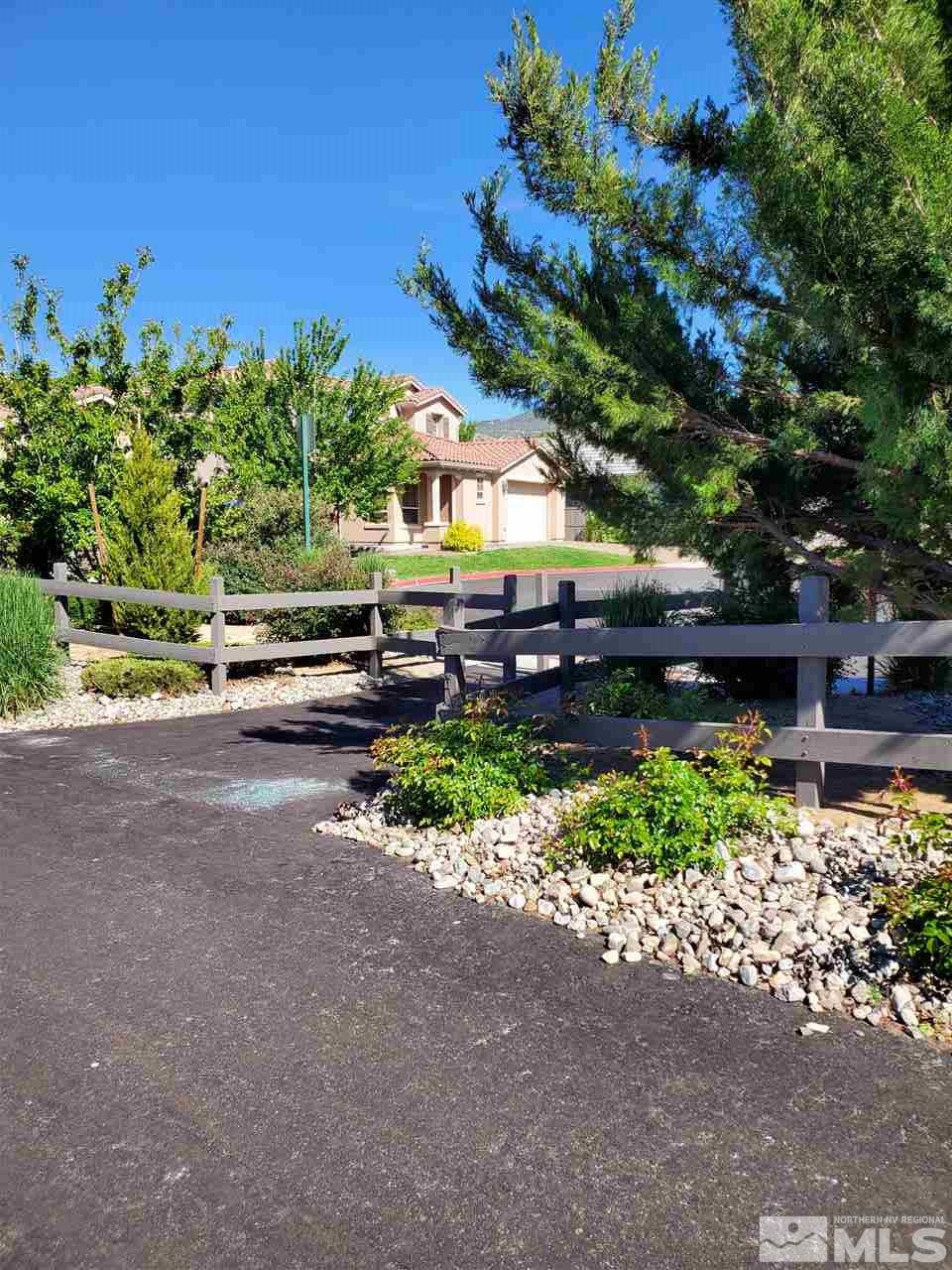 475 Silver Bridle Court Reno, NV 89521 - Photo 30 of 35 a view of a pathway with a bench