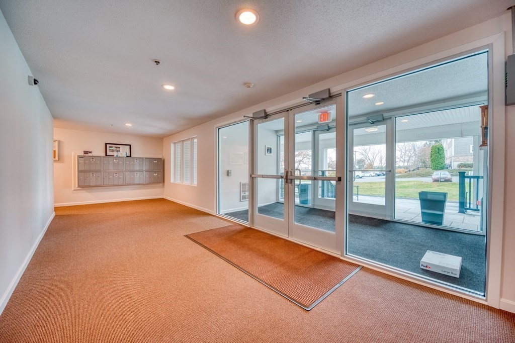 38 Dunham Road, Unit 108 Beverly, MA 01915 - Photo 23 of 30 a big room with large windows