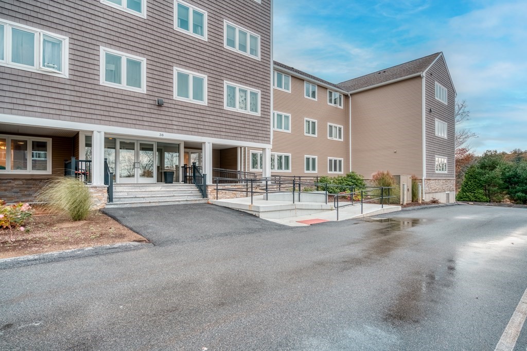38 Dunham Road, Unit 108 Beverly, MA 01915 - Photo 30 of 30 a front view of a building with street view