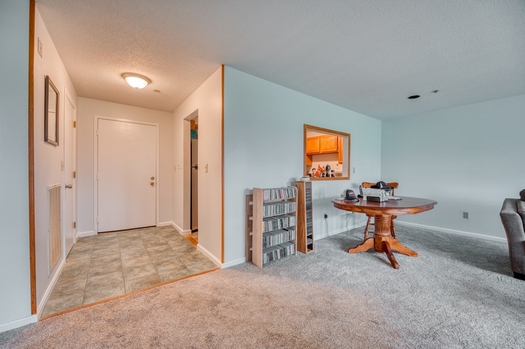 38 Dunham Road, Unit 108 Beverly, MA 01915 - Photo 7 of 30 a room with furniture and window