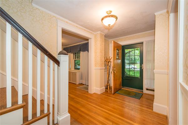 21 Follen Road Lexington, MA 02421 - Photo 3 of 19 a view of an entryway with wooden floor and door