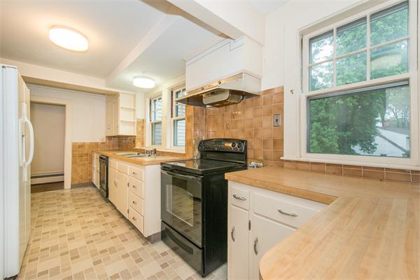 21 Follen Road Lexington, MA 02421 - Photo 6 of 19 a kitchen with granite countertop a stove a sink and a refrigerator