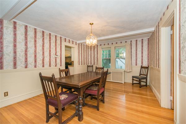 21 Follen Road Lexington, MA 02421 - Photo 8 of 19 a dining room with wooden floor a chandelier a wooden table and chairs