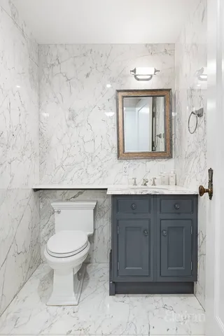 a bedroom with two beds and a flat screen tv