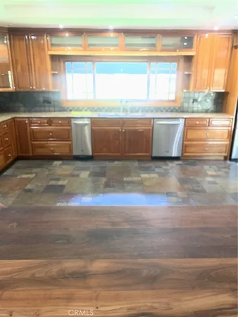 a view of kitchen with wooden floor and staircase
