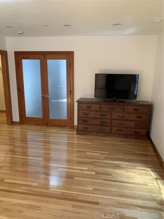 a bathroom with a granite countertop sink a mirror a vanity and a shower