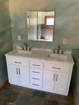 a bathroom with a toilet and a sink