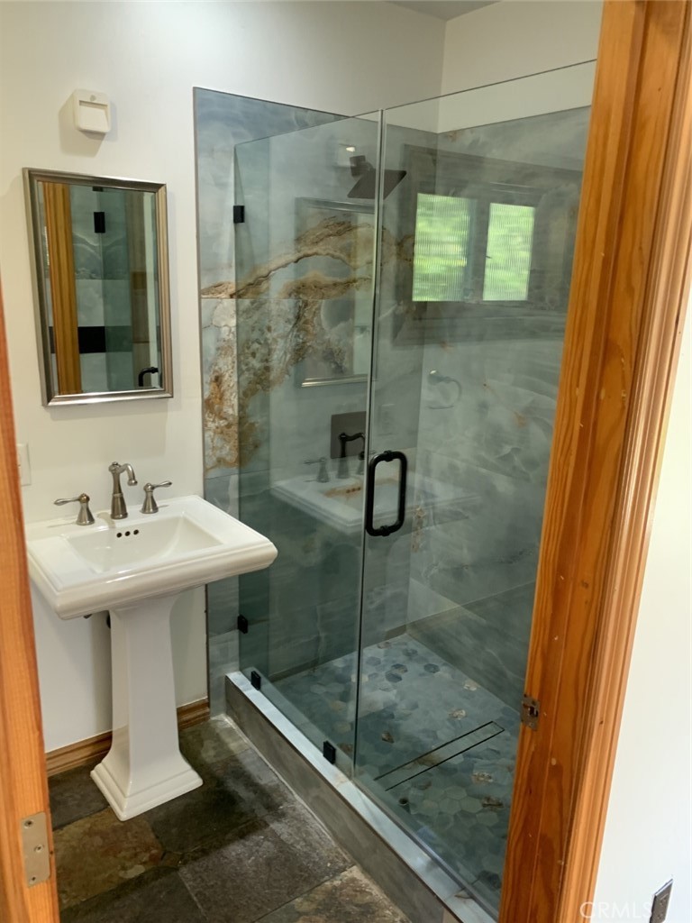 1718 Cleveland Road Glendale, CA 91202 - Photo 27 of 44 a bathroom with a sink mirror and shower