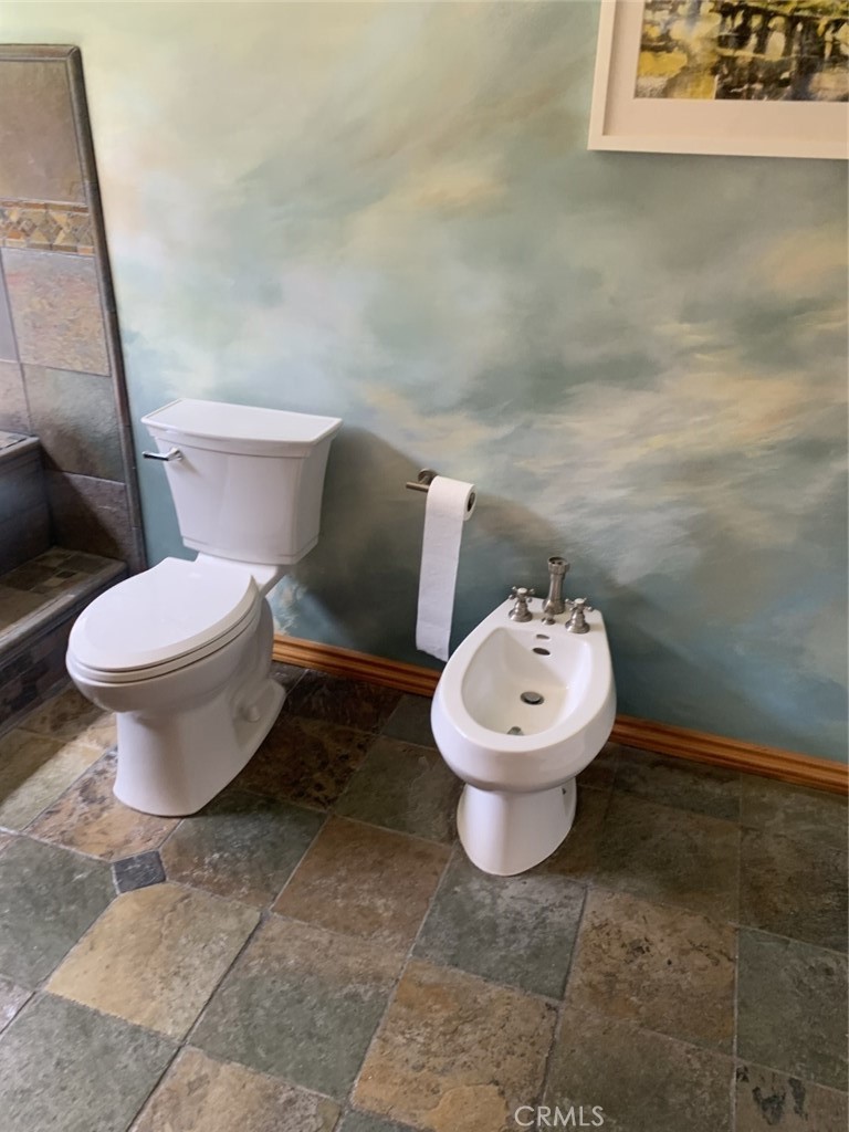 1718 Cleveland Road Glendale, CA 91202 - Photo 33 of 44 a white toilet sitting next to a bathroom sink