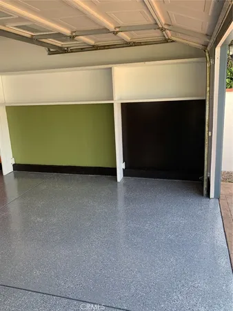 a view of a workspace with wooden floor