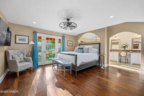 a bedroom with a bed and a couch