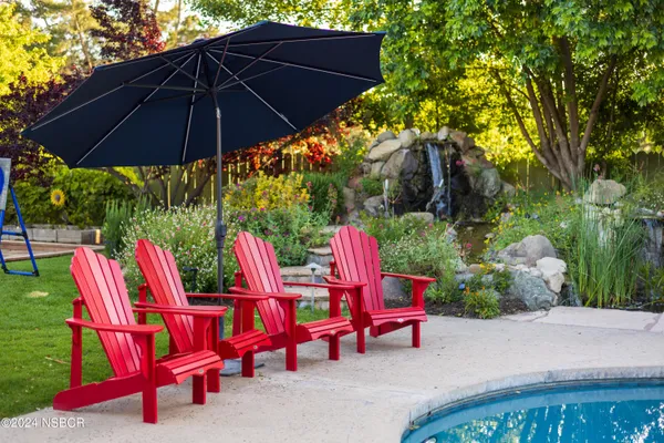 a backyard view of a house with backyard and outdoor seating