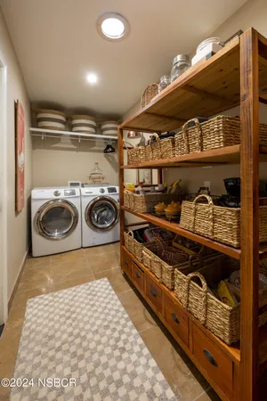 a utility room with washer and dryer