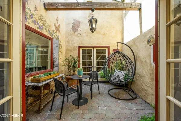 a living room with furniture a rug and a fireplace