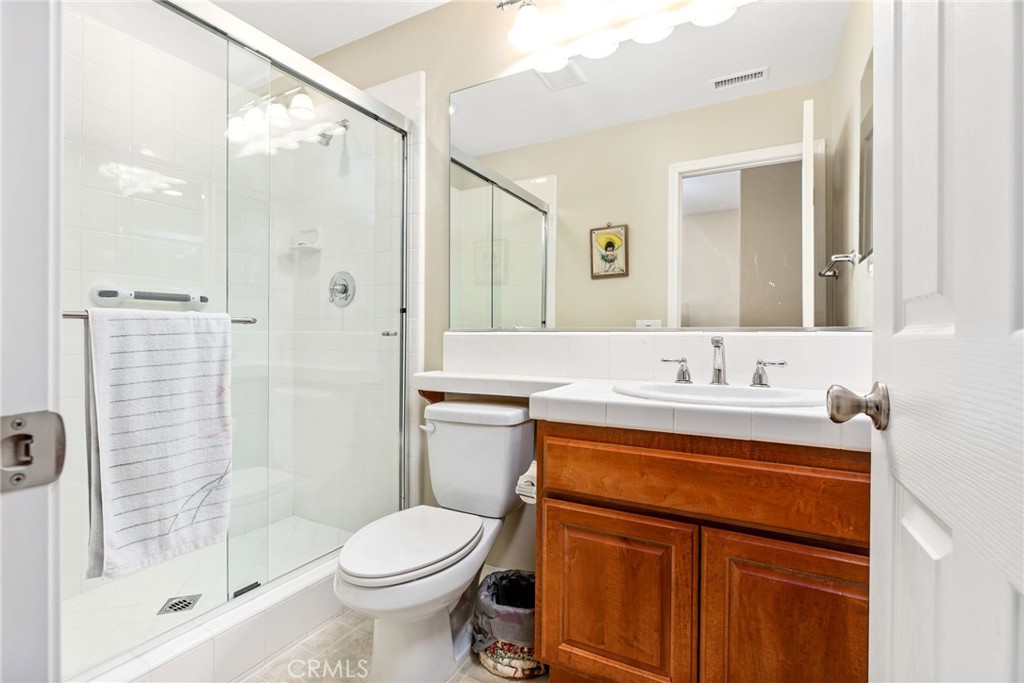 34641 Irwin Street Beaumont, CA 92223 - Photo 12 of 63 a bathroom with a sink a toilet and shower