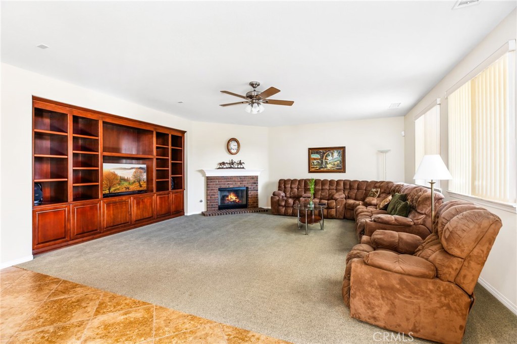 34641 Irwin Street Beaumont, CA 92223 - Photo 13 of 63 a living room with furniture and a fireplace