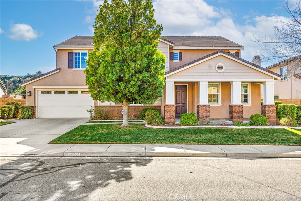 34641 Irwin Street Beaumont, CA 92223 - Photo 2 of 63 a front view of a house with a yard