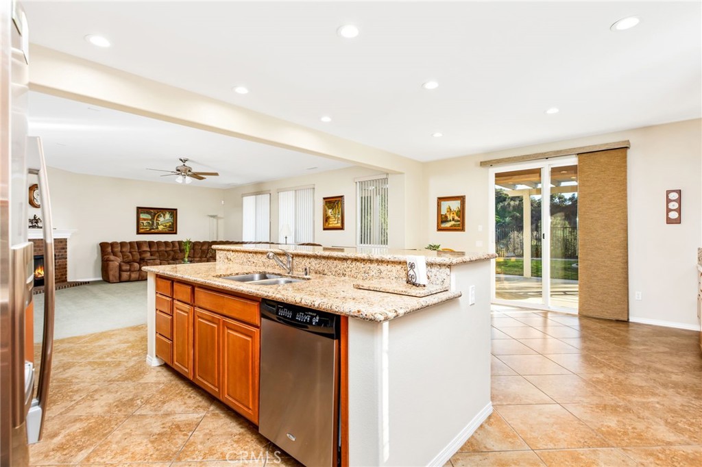34641 Irwin Street Beaumont, CA 92223 - Photo 21 of 63 a large kitchen with a stove and a sink