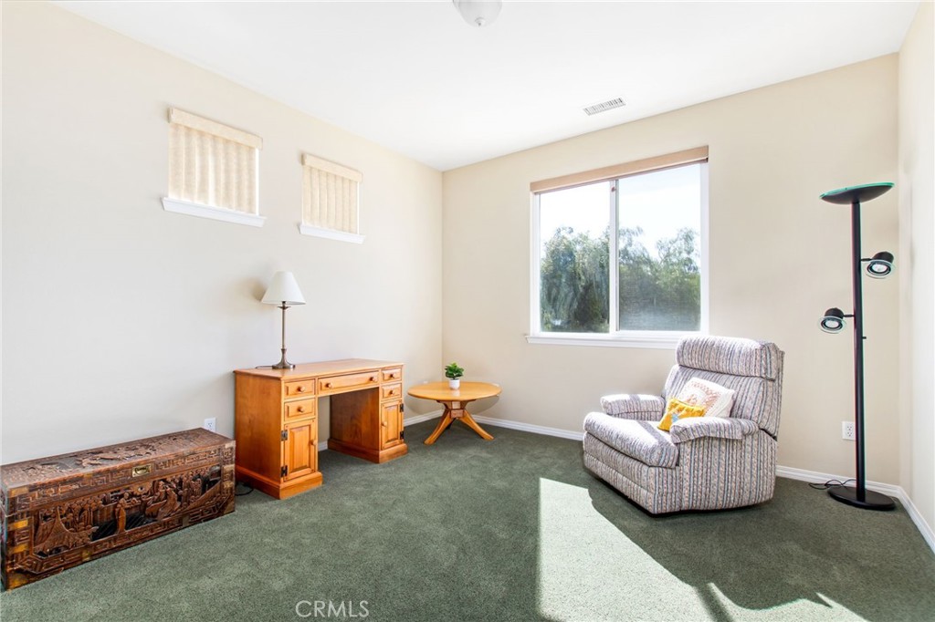 34641 Irwin Street Beaumont, CA 92223 - Photo 25 of 63 a living room with furniture and a window