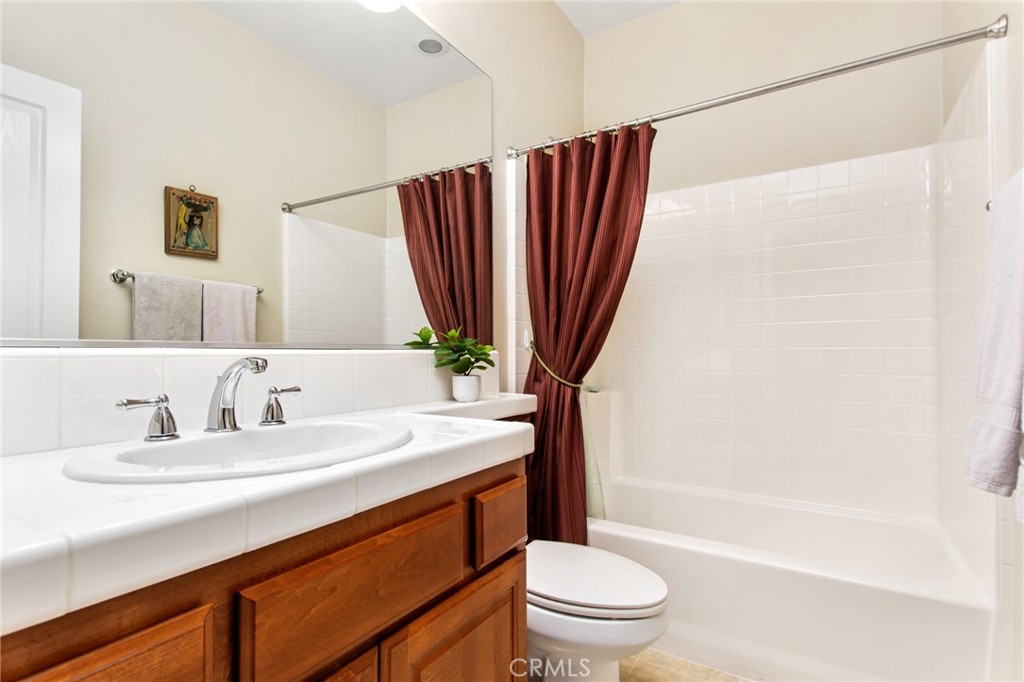 34641 Irwin Street Beaumont, CA 92223 - Photo 28 of 63 a bathroom with a sink a toilet and shower