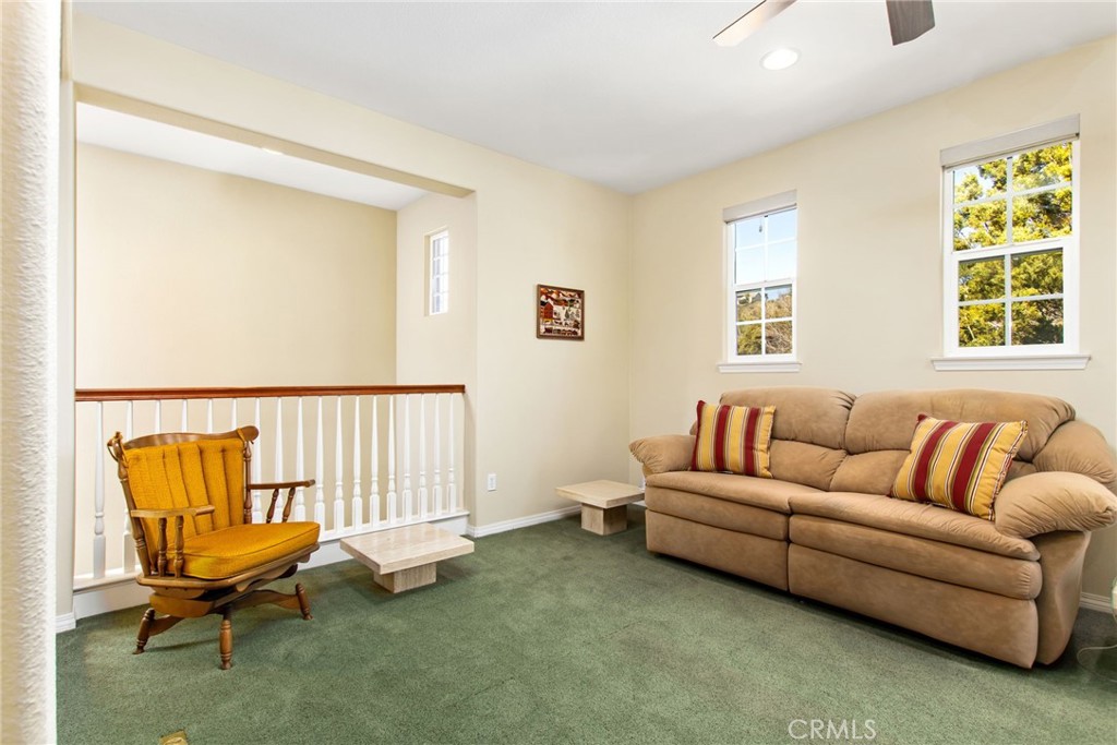 34641 Irwin Street Beaumont, CA 92223 - Photo 29 of 63 a living room with furniture and a window
