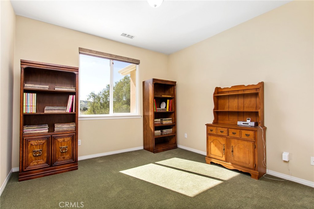 34641 Irwin Street Beaumont, CA 92223 - Photo 31 of 63 a living room with closet and window