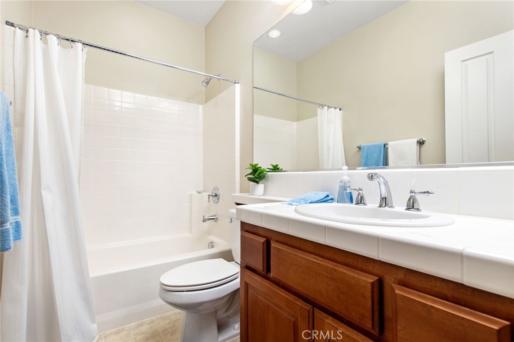 34641 Irwin Street Beaumont, CA 92223 - Photo 33 of 63 a bathroom with a sink a toilet and shower