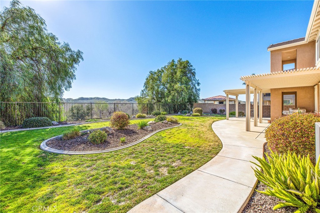 34641 Irwin Street Beaumont, CA 92223 - Photo 42 of 63 a swimming pool with outdoor seating and yard