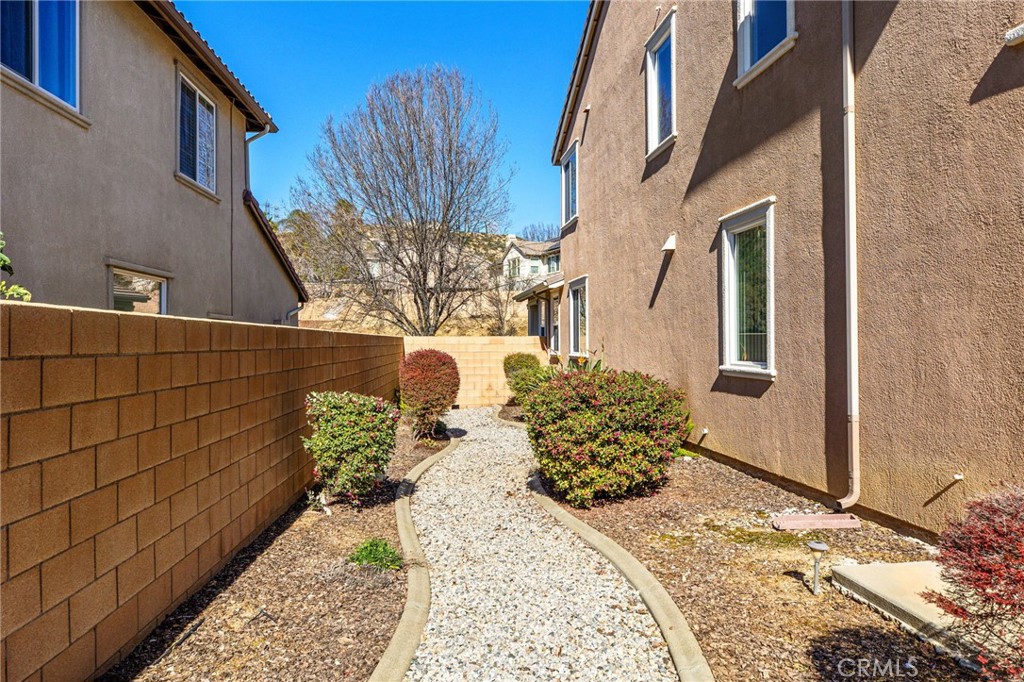 34641 Irwin Street Beaumont, CA 92223 - Photo 46 of 63 a view of a potted flower in the corridor