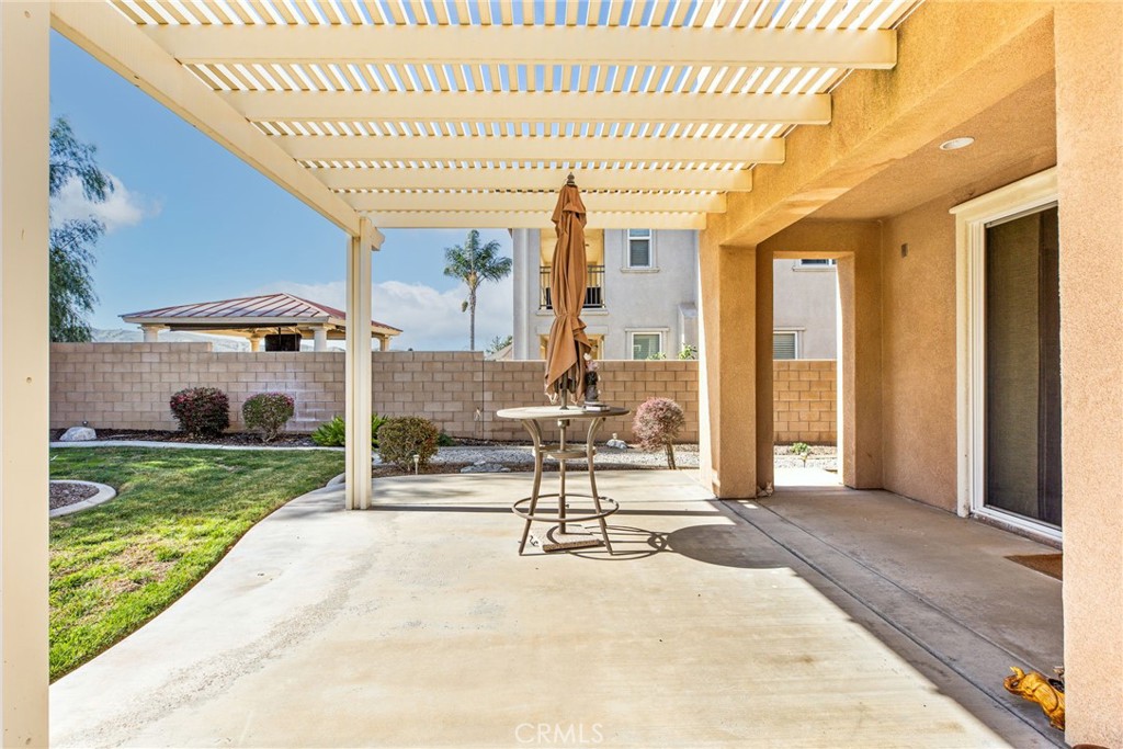 34641 Irwin Street Beaumont, CA 92223 - Photo 48 of 63 a view of a patio with table and chairs
