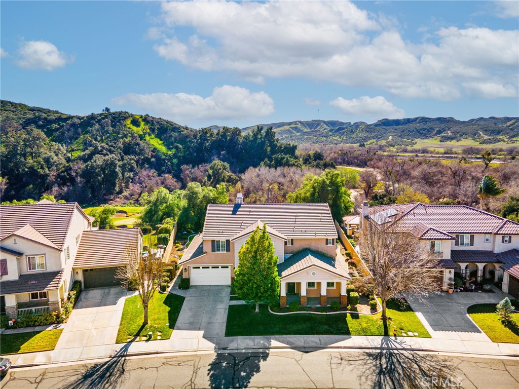 34641 Irwin Street Beaumont, CA 92223 - Photo 50 of 63 an aerial view of a house with swimming pool and mountains