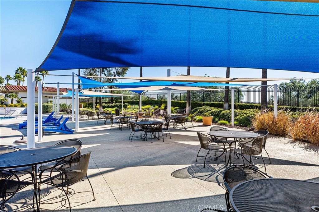 34641 Irwin Street Beaumont, CA 92223 - Photo 55 of 63 a view of a patio with table and chairs under an umbrella